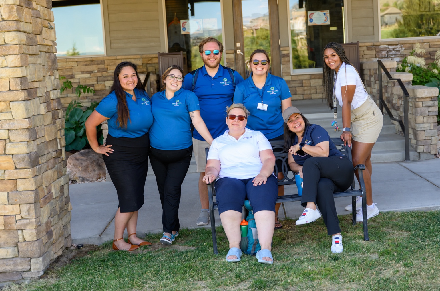 PCAU staff gathered outside, smiling together.